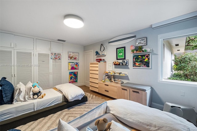 bedroom featuring light wood-type flooring