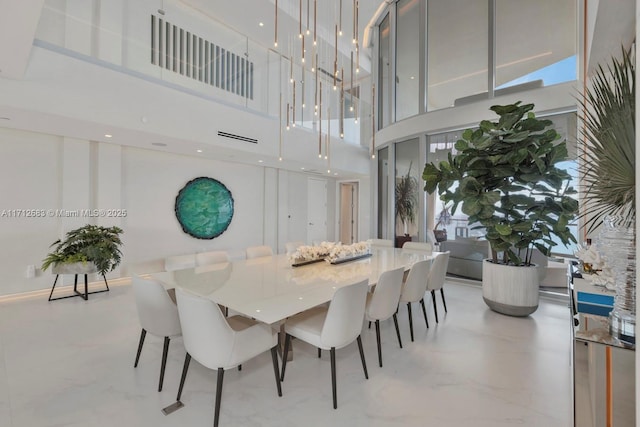 dining space featuring a high ceiling