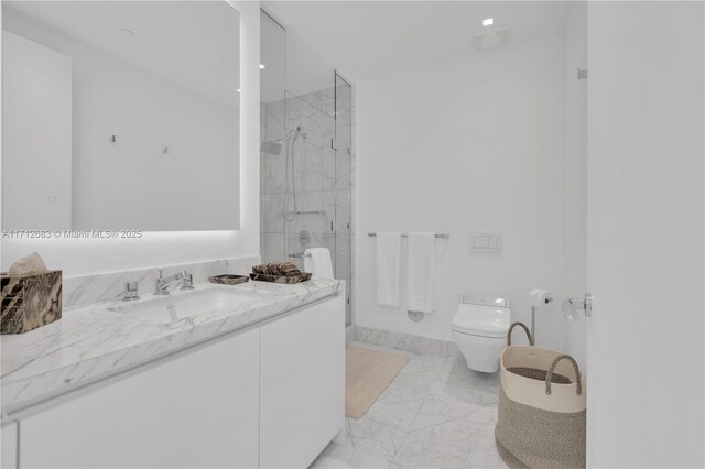 bathroom with vanity, toilet, and a shower with door