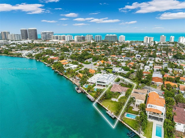 birds eye view of property featuring a water view