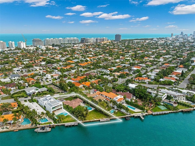 birds eye view of property featuring a water view