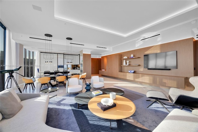 living room featuring a raised ceiling