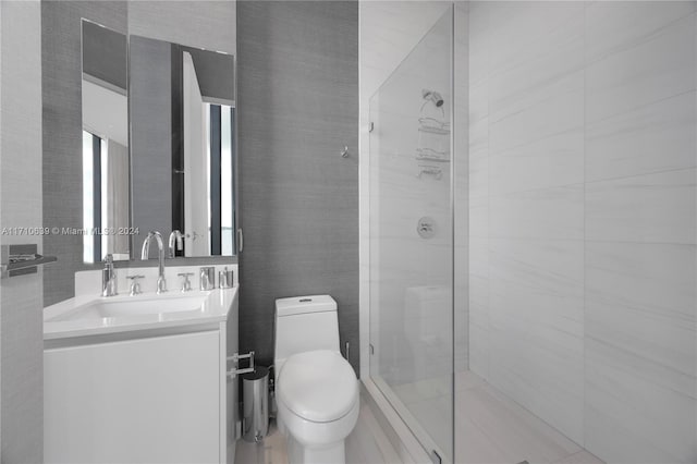 bathroom with vanity, toilet, and an enclosed shower