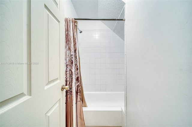 bathroom with shower / bath combination with curtain