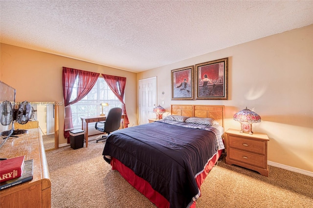 bedroom featuring a textured ceiling and light carpet