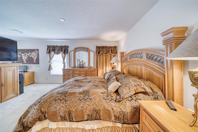 carpeted bedroom with a textured ceiling