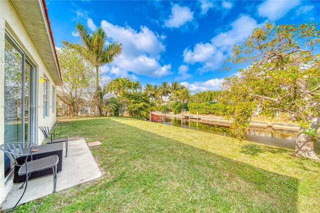 view of yard with a water view