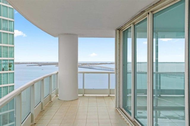 balcony featuring a water view