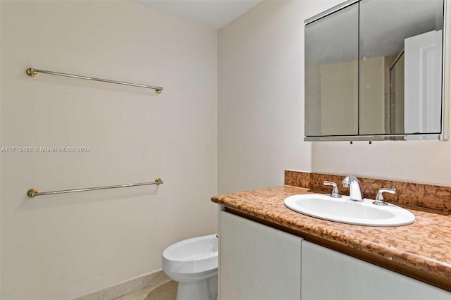 bathroom featuring vanity, tile patterned floors, and a bidet