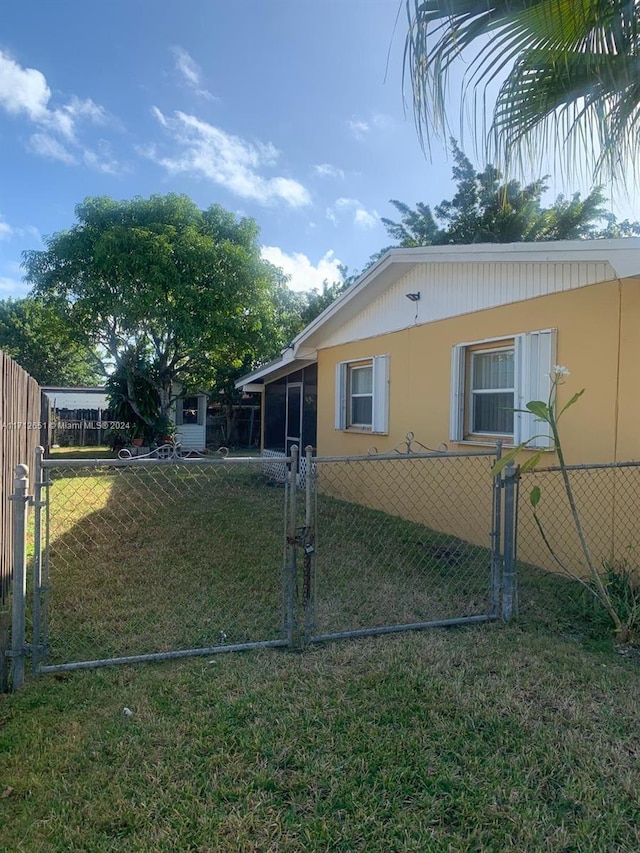 view of home's exterior with a yard