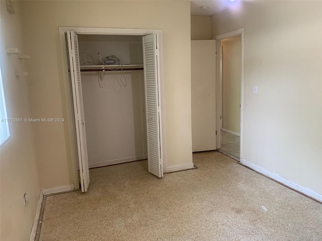 unfurnished bedroom with a closet