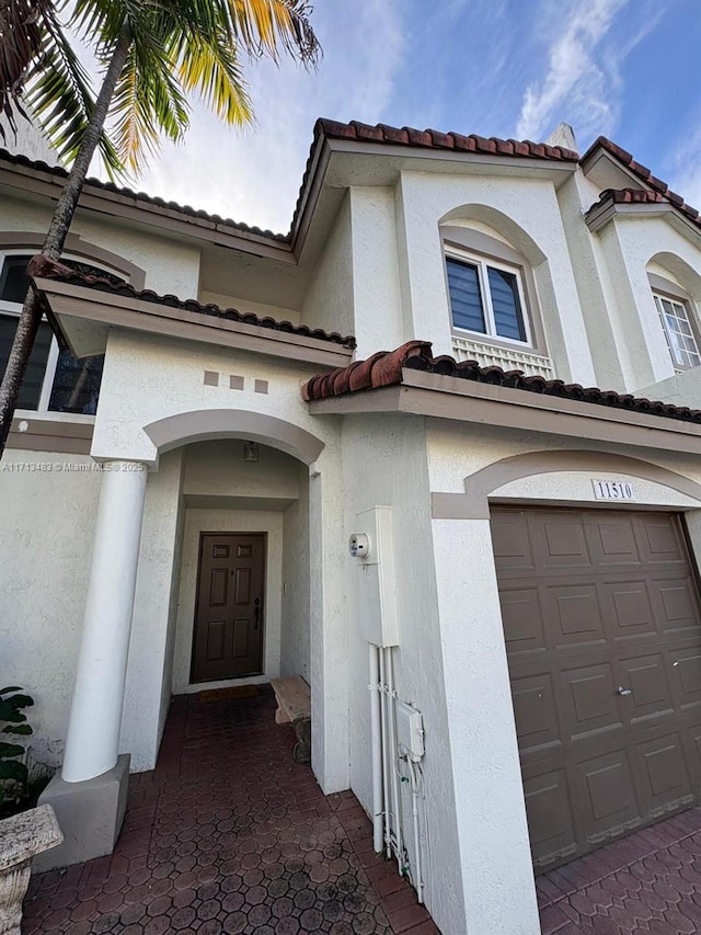 entrance to property featuring a garage