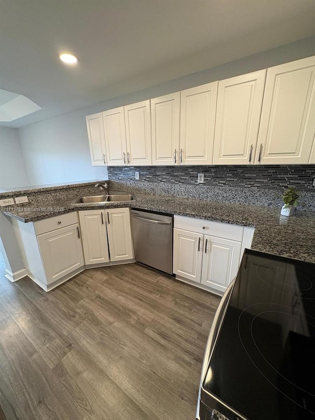 kitchen featuring white cabinetry, dishwasher, electric range oven, and sink