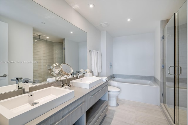 full bathroom with shower with separate bathtub, vanity, and toilet