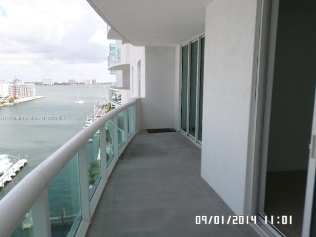 balcony featuring a water view