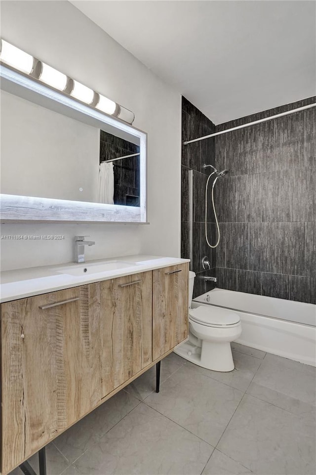 full bathroom featuring shower / tub combo with curtain, vanity, and toilet