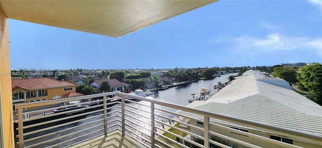 balcony featuring a water view