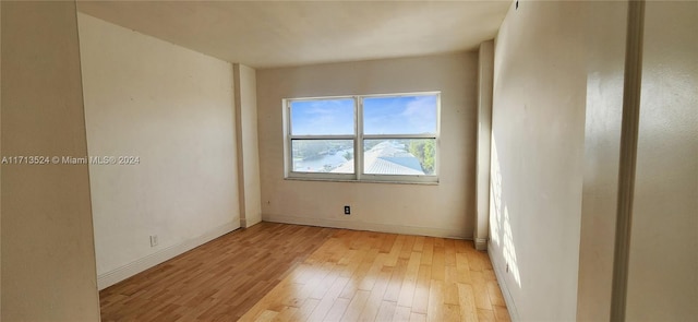 spare room with light wood-type flooring