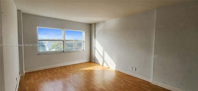 empty room with light hardwood / wood-style floors