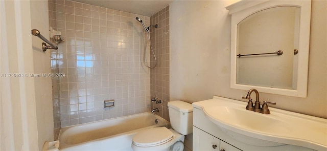 full bathroom with vanity, toilet, and tiled shower / bath