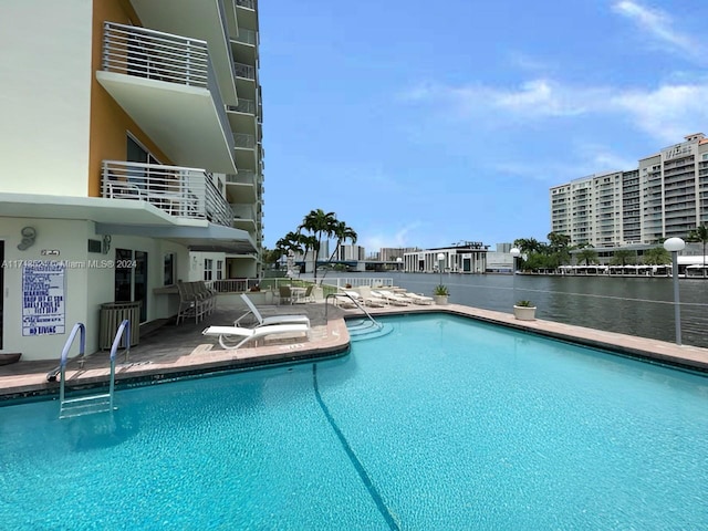 view of swimming pool featuring a patio area