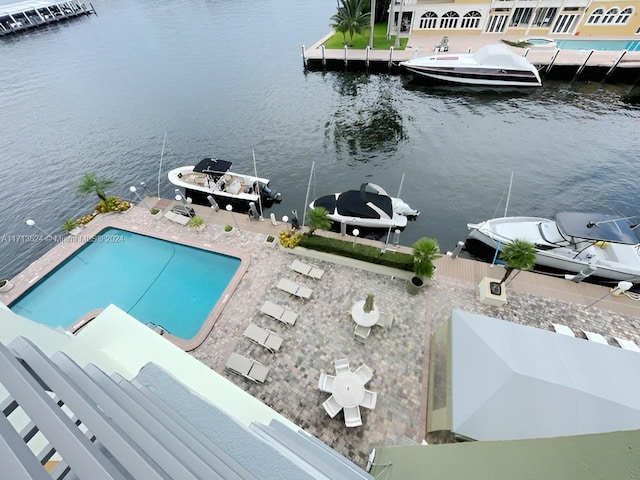 birds eye view of property featuring a water view