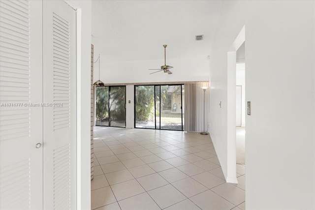 hall featuring light tile patterned flooring