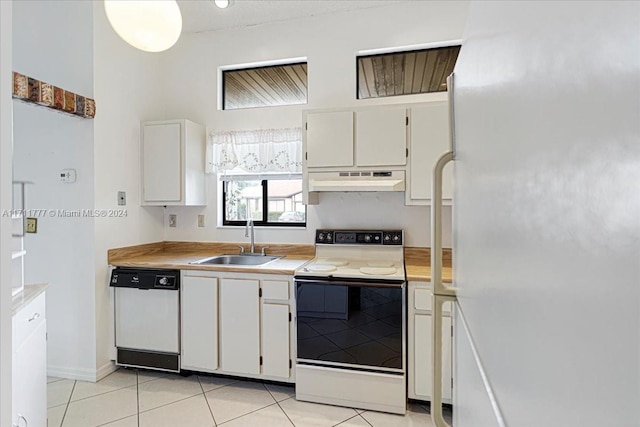 kitchen with white cabinetry, white appliances, sink, and light tile patterned floors