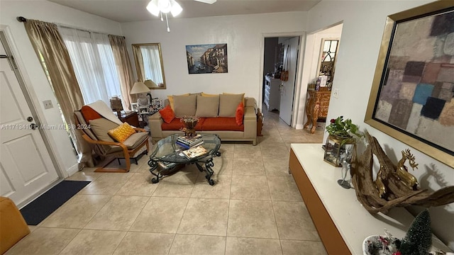 tiled living room featuring ceiling fan