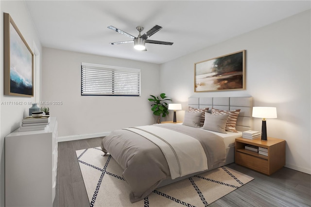 bedroom with ceiling fan, baseboards, and wood finished floors