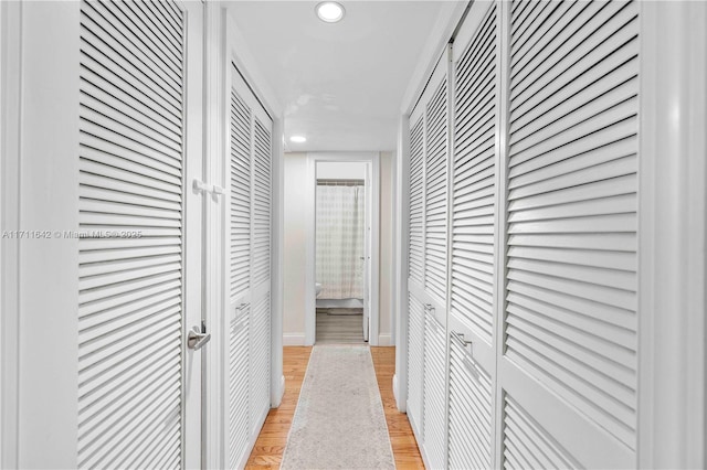 corridor featuring recessed lighting and light wood-style floors