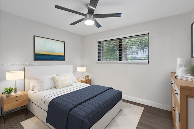 bedroom with wood finished floors, baseboards, and ceiling fan