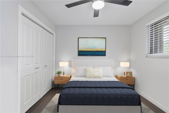 bedroom featuring ceiling fan, wood finished floors, a closet, and baseboards