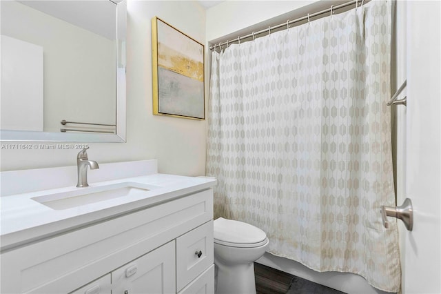 full bathroom featuring toilet and vanity