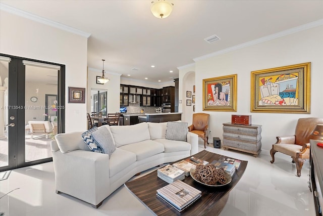 living room featuring french doors and ornamental molding