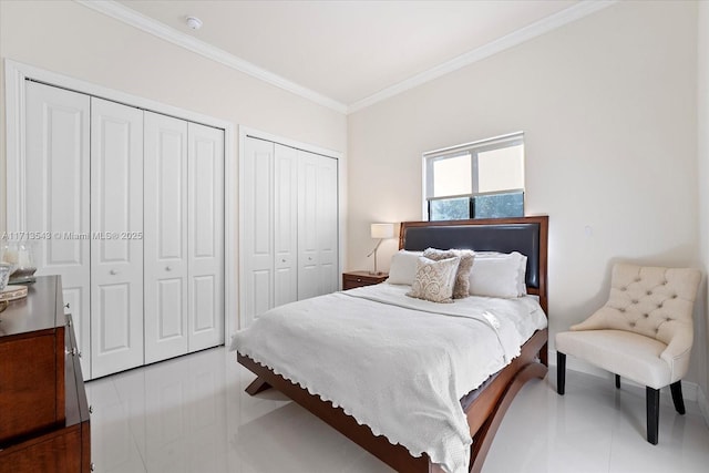 bedroom featuring crown molding and multiple closets