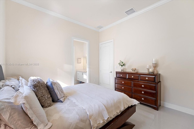 bedroom with ornamental molding and connected bathroom