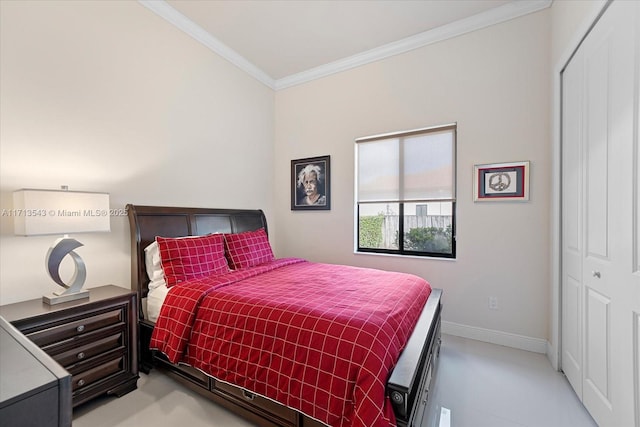 bedroom featuring a closet and crown molding