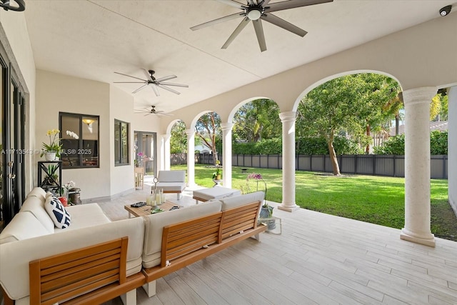 view of patio with outdoor lounge area and ceiling fan