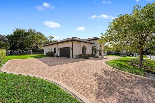 view of front facade featuring a front lawn and a garage