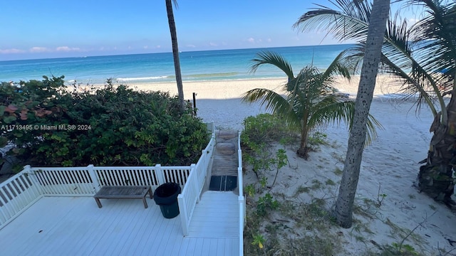 property view of water featuring a beach view