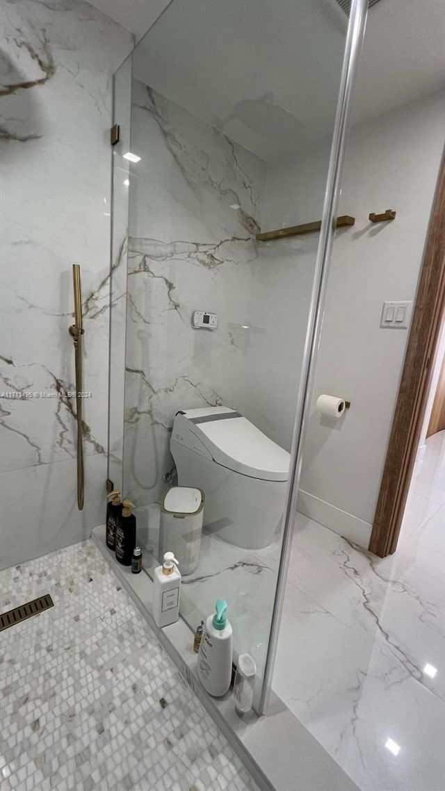 bathroom with a shower and toilet