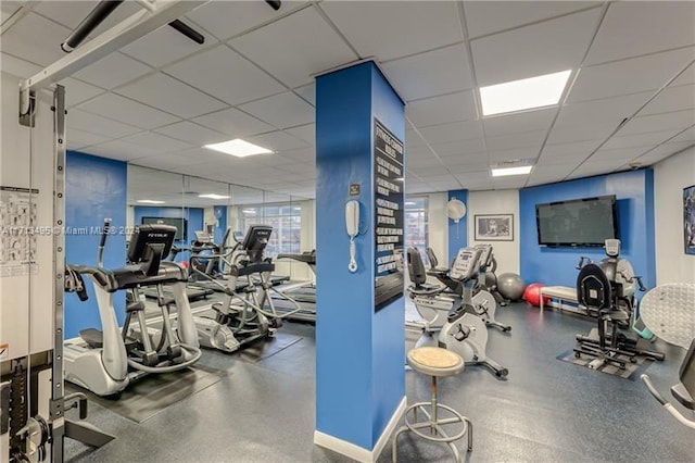 exercise room with a drop ceiling