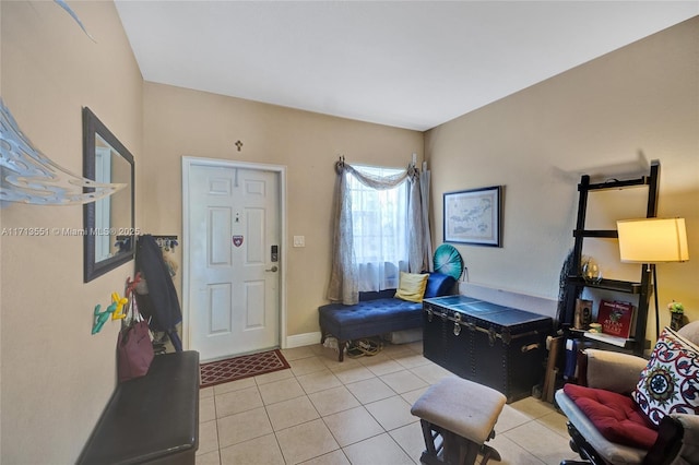 foyer entrance with baseboards and light tile patterned floors