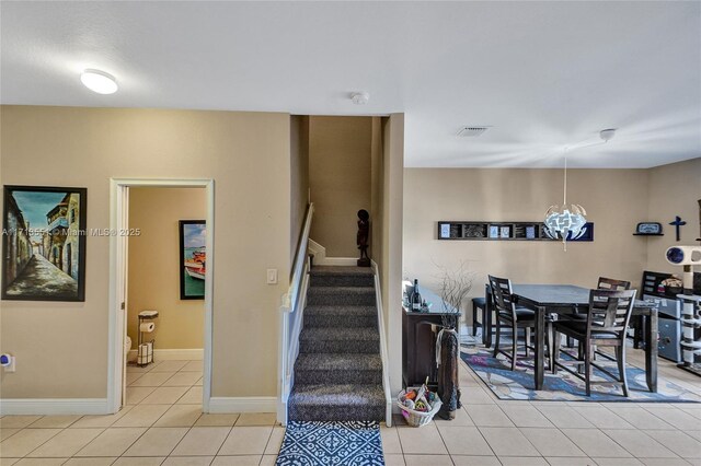 living area with light tile patterned floors