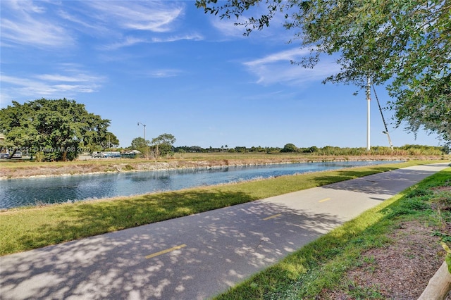 view of home's community with a water view