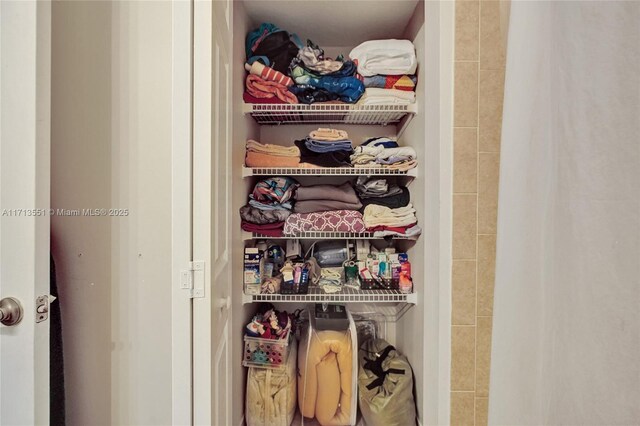 clothes washing area with separate washer and dryer