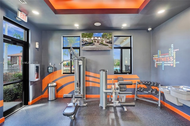 workout area featuring baseboards and recessed lighting