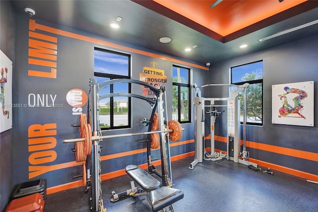 workout area featuring recessed lighting and baseboards