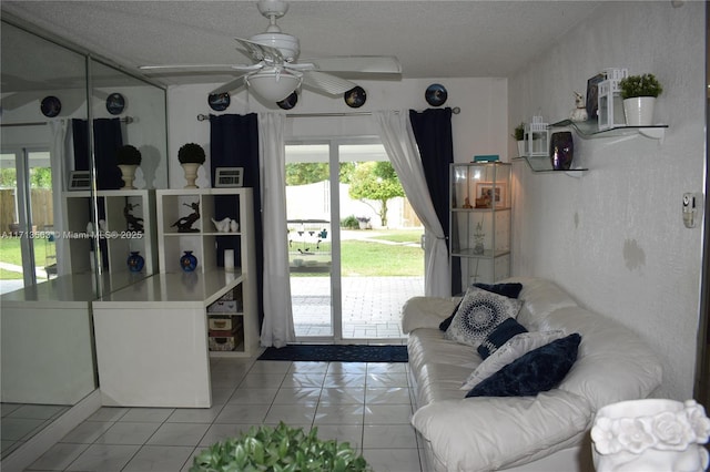 interior space featuring ceiling fan and a textured ceiling